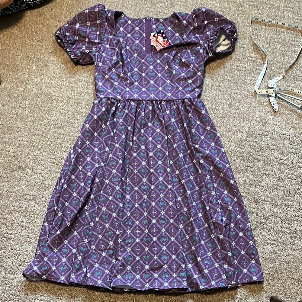 PUG Lucrezia Day in Crown print crepe dress